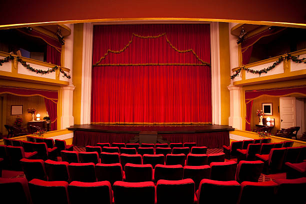 Red theater performance stage Spotlight on the stage curtains in a movie, opera or concert hall stage performance space stock pictures, royalty-free photos & images