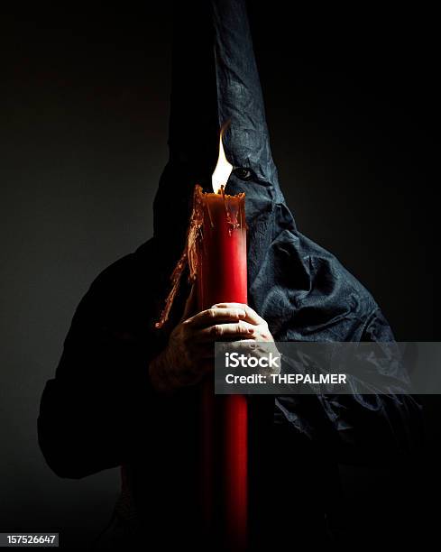 Nazareno Holding A Candle Stock Photo - Download Image Now - Candle, Hood - Clothing, Seville