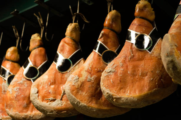 Italian Prosciutto hanging in Line  parma ham stock pictures, royalty-free photos & images