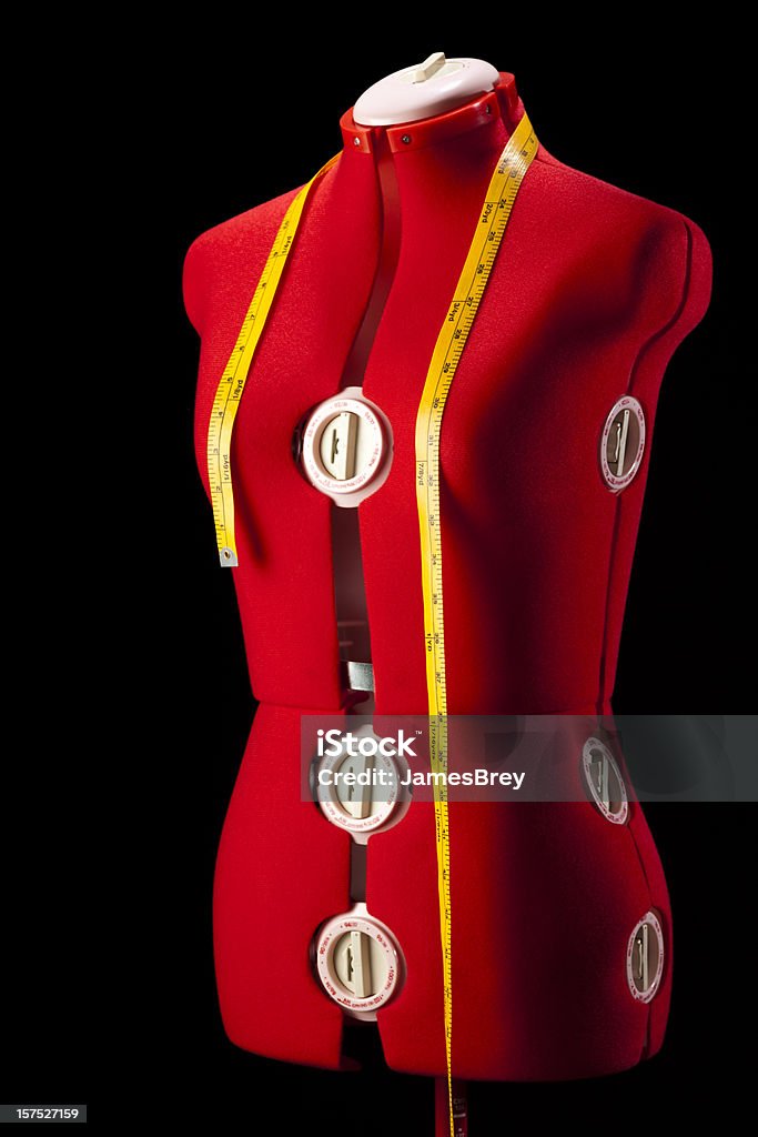 Red Dress Fitting Mannequin Torso Form With Yellow Tape Measure  Tailor Stock Photo