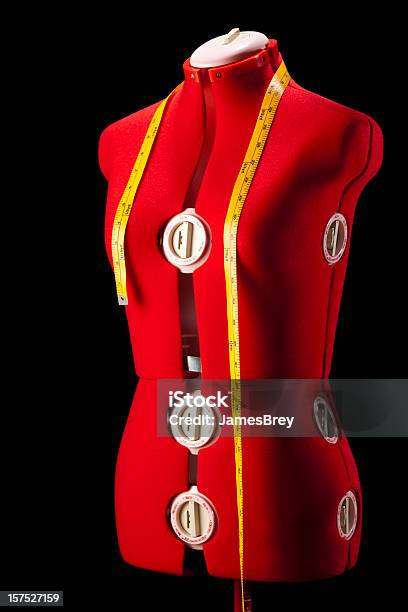 Red Dress Fitting Mannequin Torso Form With Yellow Tape Measure Stock Photo - Download Image Now