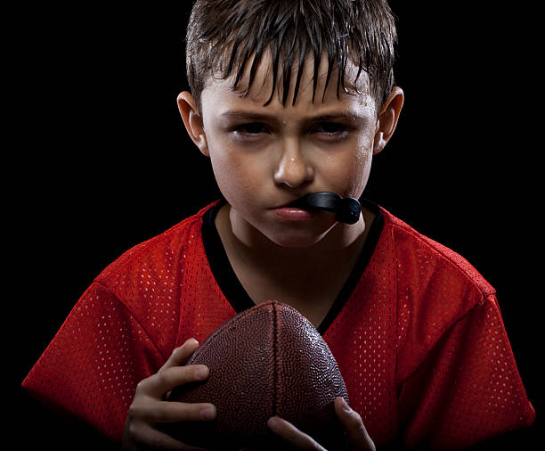 istock Young Intense Football player 157527169