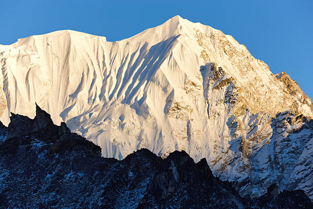 Snow covered peaks in Himalayan mountains range valley of the Annapurna circuit trail route in Nepal