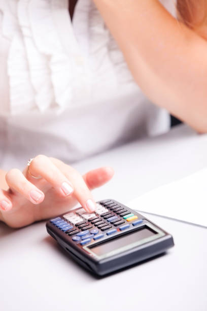 istock Businesswoman with calculator 157527292