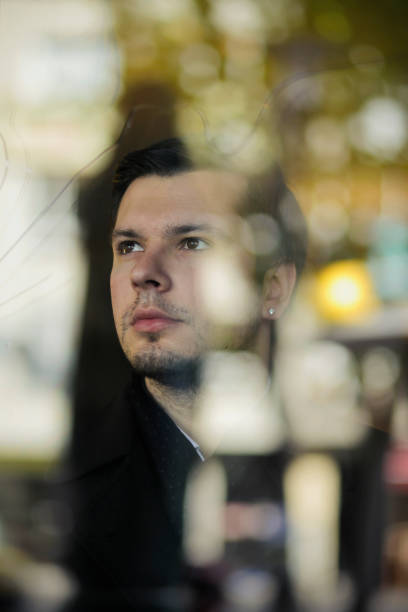 istock Young Businessman Watching Outside From the Window 157527504