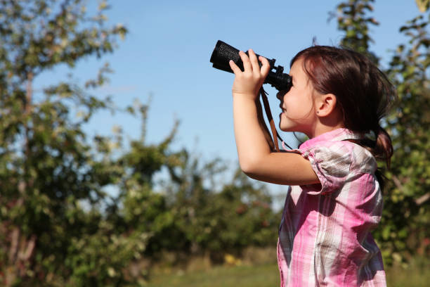 istock Young girl with binoculars 157527622