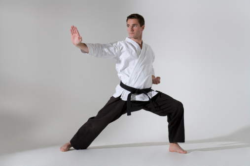 Young martial artist in defense position