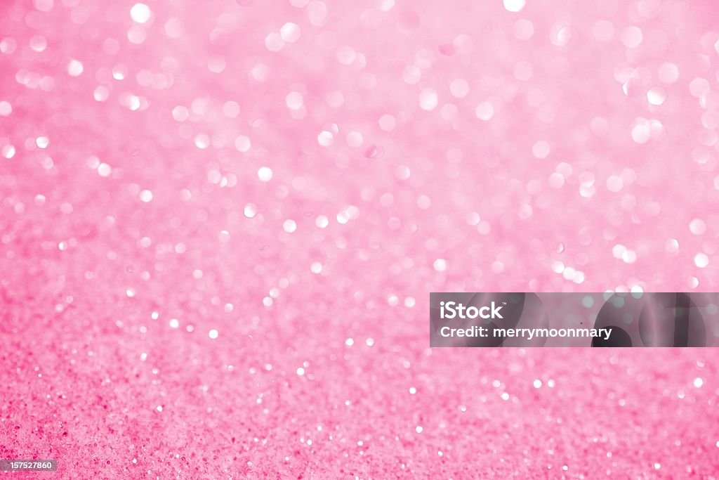 Pink Sugar Sparkle Background XXXL photo of crystal glittery pink sugar with selective focus along bottom to create blurred sparkles over most of the top 3/4ths for copy space.  Bright and sweet background. Backgrounds Stock Photo