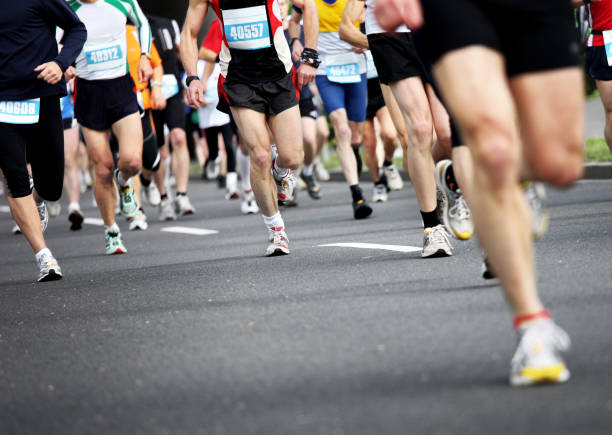 Marathon running athletes at a marathon. Need more images like that: distance running stock pictures, royalty-free photos & images