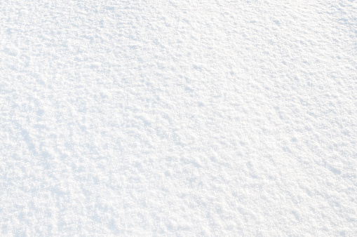 A frozen background texture of pure, untouched snow.