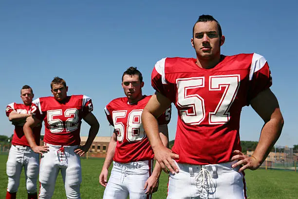 Football players with hardcore attitude – ready to bring it. Hard shadows added to accentuate the bad attitude, especially around the the eyes.