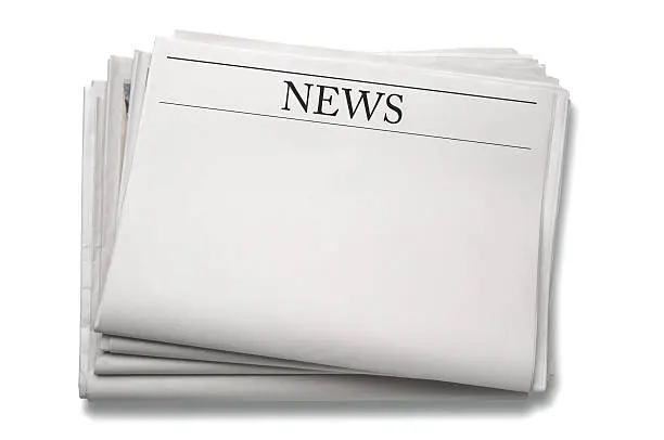 Photo of A stack of blank newspapers against a white background