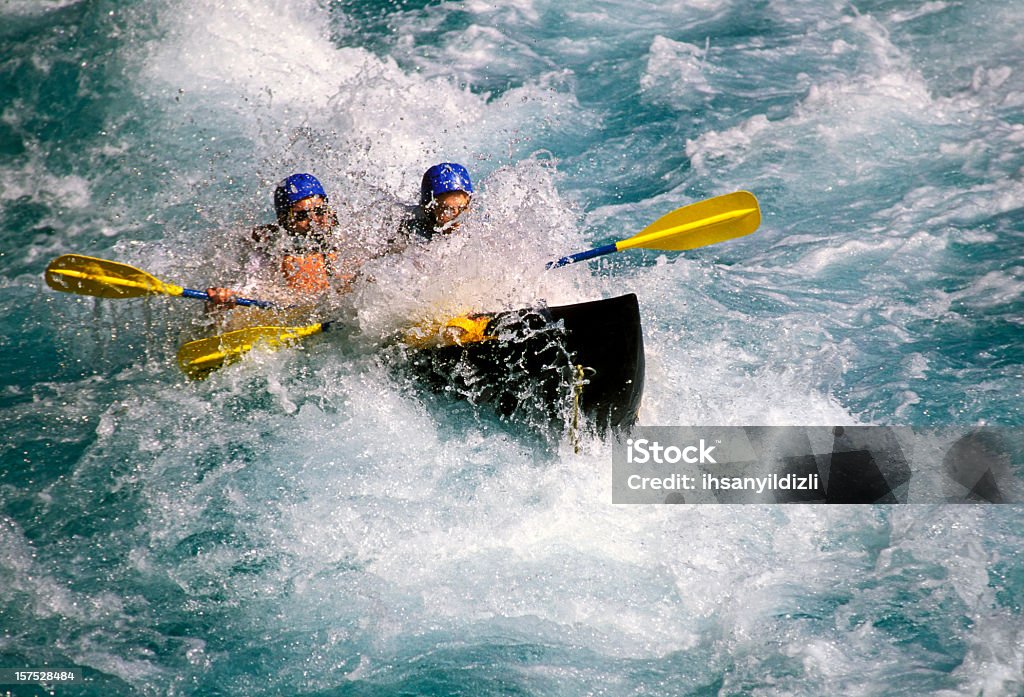 Rafting on White Water Two people rafting on white water. White Water Rafting Stock Photo