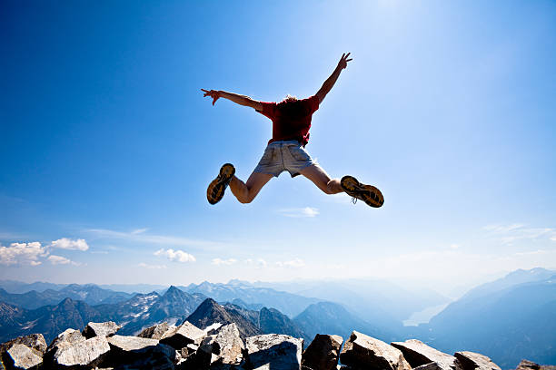 istock Jumping off of a mountain 157528695