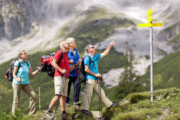 istock senior hikers at fingerpost 157528702