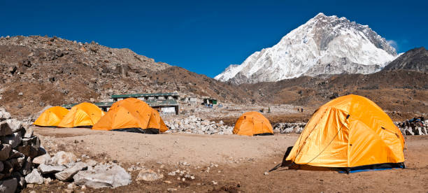 istock Base camp tents Himalaya peaks Nuptse Gorak Shep Nepal panorama 157528715