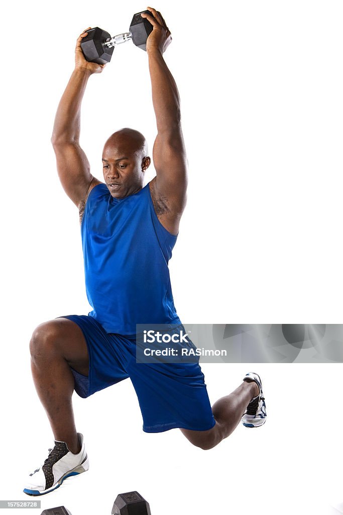 Fit Man Doing A Lunge Handsome fit man doing a lunge with weights overhead. White Background Stock Photo