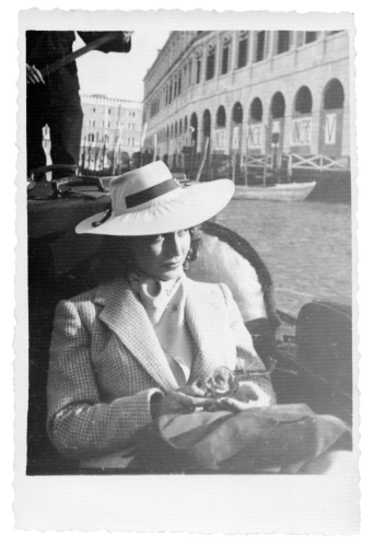 Young woman sitting in gondola,1935,Venice,Italy.