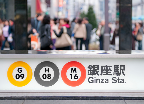 Information sign displaying line information at a street entrance to Ginza station in Tokyo.