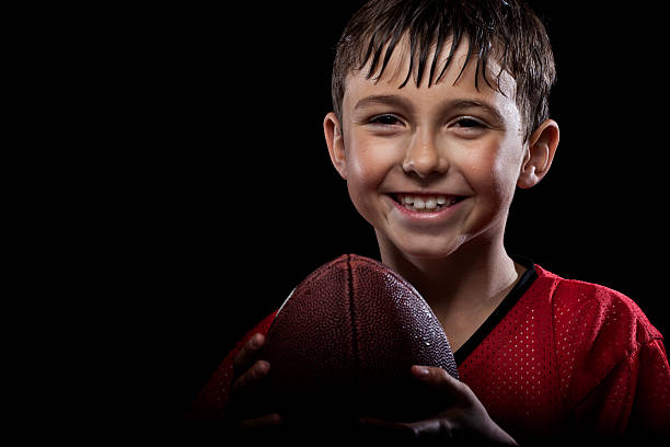 istock Young happy football player 157528837