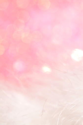 XXXL photo of blurred lights in pink with white soft feathers with very short depth of field.