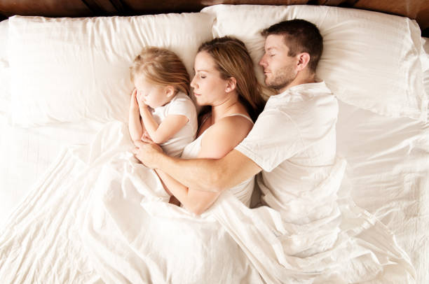 Sleeping Family stock photo