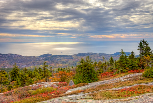 Cadillac Mountain in acadia National Park, Maine at 1532 feet, is the tallest mountain on Mount Desert island and the highest point along the North Atlantic seaboard. Photo taken on a calm tranquil morning during the peak fall foliage season. Maine fall foliage ranks with the best in New England