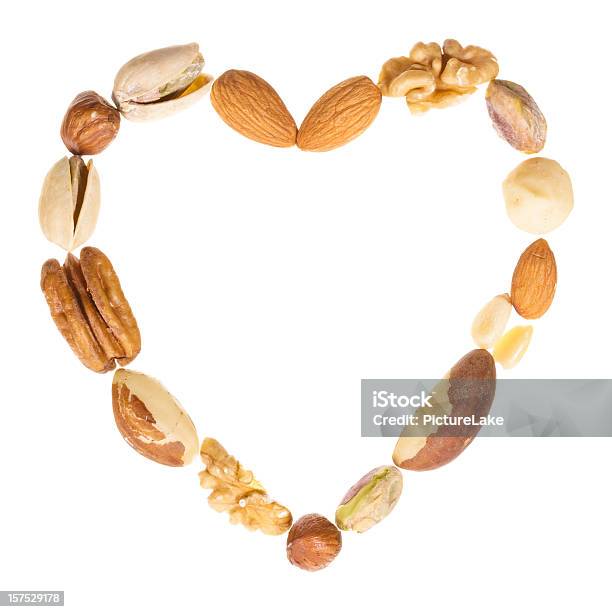 Variado De Tuercas Corazón De Bastidor Foto de stock y más banco de imágenes de Fruto seco - Fruto seco, Símbolo en forma de corazón, Recortable
