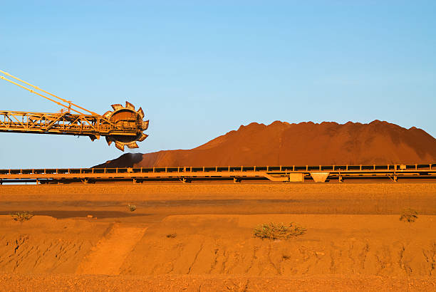 Stockpiling Iron Ore Mine  Reclaimer stock pictures, royalty-free photos & images