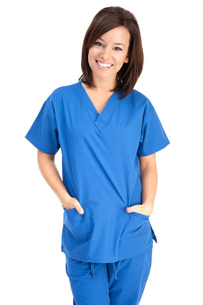 jovem simpática em azul esfoliações enfermeira - nurse scrubs isolated doctor - fotografias e filmes do acervo