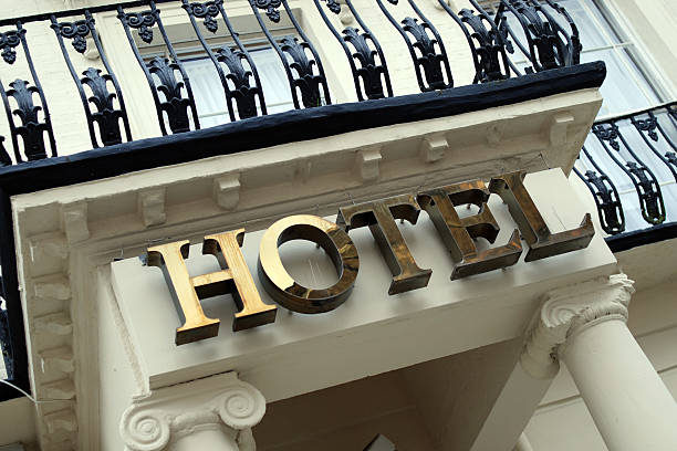 Hotel sign on building stock photo
