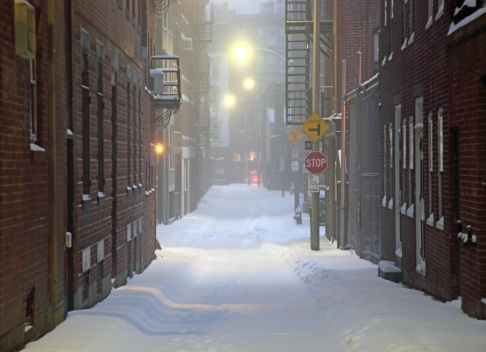 Dark cold snowy city street in Boston