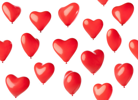 Heart shaped balloons isolated on white,, no overlapping ones,, all in the same orientation,, moving up