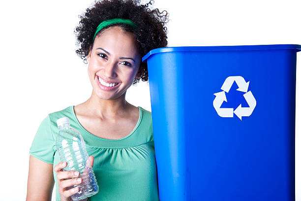 istock smiling woman with recycling bin and plastic bottle 157529457