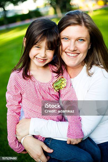 Mother Holding Daughter Stock Photo - Download Image Now - Adult, Affectionate, Beautiful People