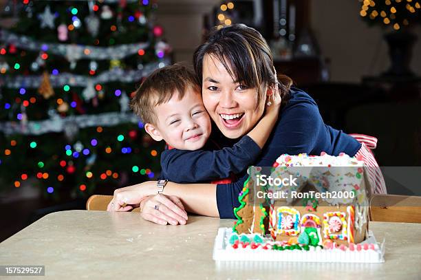 Christmas Hugs Stock Photo - Download Image Now - Gingerbread House, Family, Making