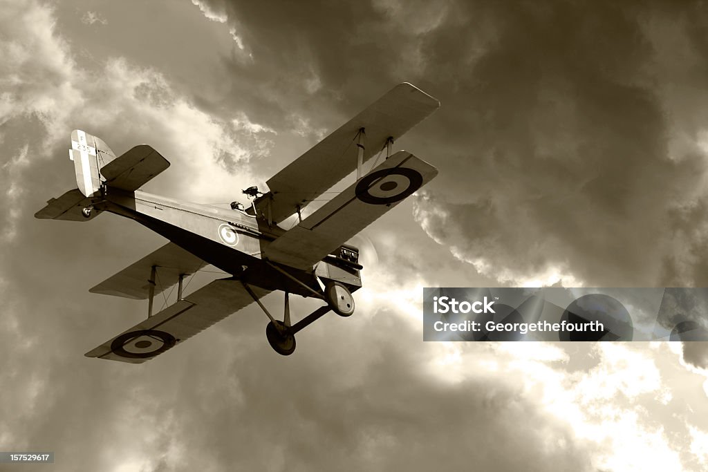 Vintage biplane flying into storm clouds World War 1 Bi-plane flies towards stormy clouds. Vintage grainy sepia tone added.

More WW2 themed shots here...
[url=http://www.istockphoto.com/my_lightbox_contents.php?lightboxID=944093 
t=_blank][img]http://i957.photobucket.com/albums/ae51/Georgethefourth/My%20favourites/WW2.jpg?t=1277068552[/img][/url] World War I Stock Photo