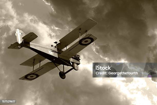 Vintage Biplane Flying Into Storm Clouds Stock Photo - Download Image Now - World War I, Biplane, Piloting