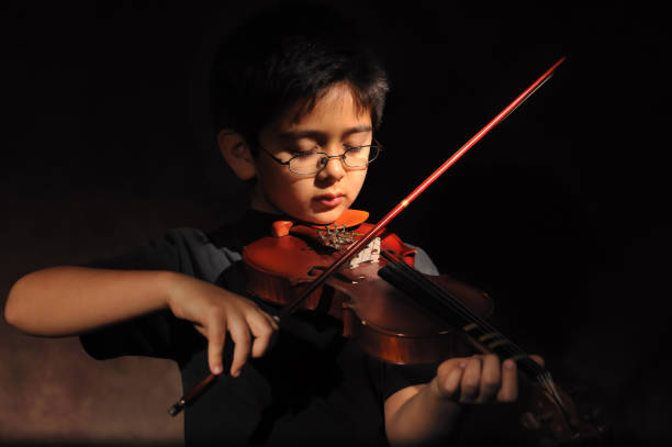 istock Child playing the violin 157529620