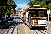 San Francisco historic cable car overlooking bay pier Alcatraz Island