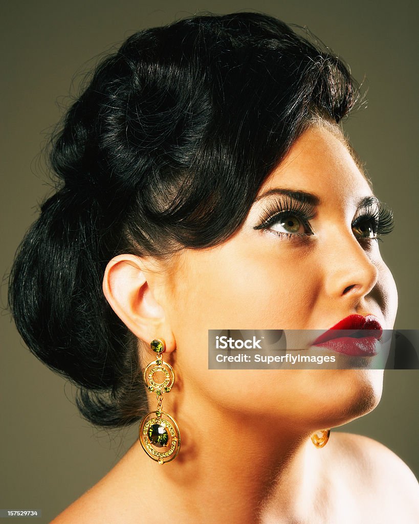 Portrait of a Glamorous Woman Looking Up and Away  20-29 Years Stock Photo