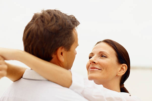 istock Smiling lady embracing her husband 157529815