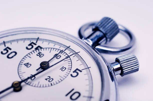 istock Macro Shot of Stopwatch Hands Against White 157530045