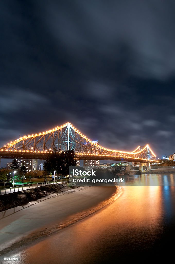 Brisbane Story Bridge at Night Reflections from the famous bridge over the Brisbane river in the state capital's city centre.  Queensland, Australia. Architecture Stock Photo