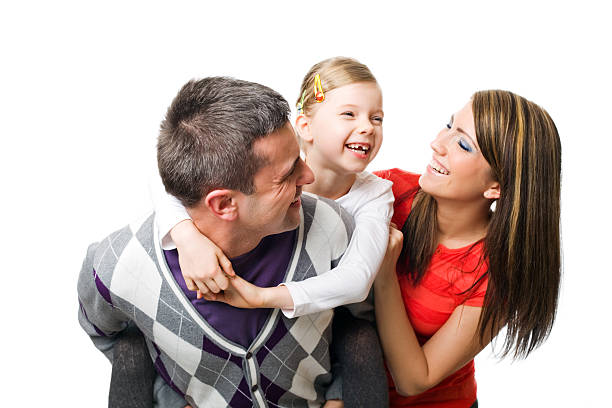 Happy little girl hugs his dad, pink background