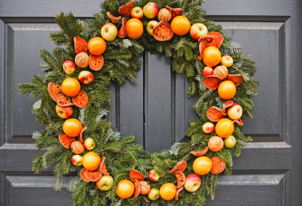 istock Natural Christmas wreath with apples and oranges 157530225