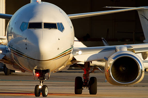 Front view of a business jet on the runway stock photo