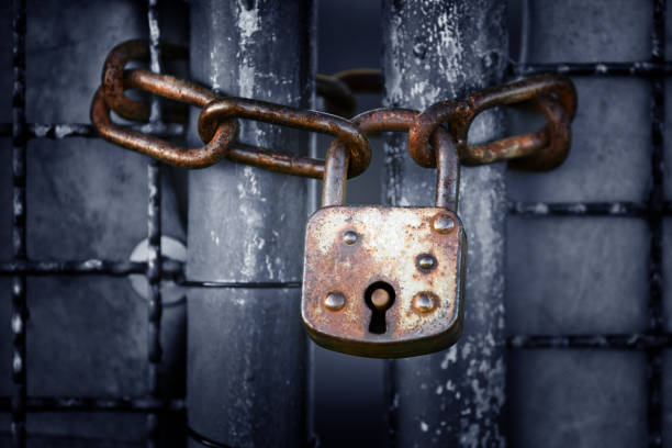 Old Lock And Chain Old lock and chain. Canon Mark III and 200mm tele with selective focus. rusted chain stock pictures, royalty-free photos & images