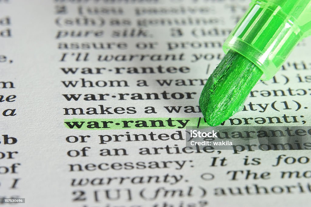 warranty definition highligted in dictionary dictionary word warranty highlighted with green marker Agreement Stock Photo