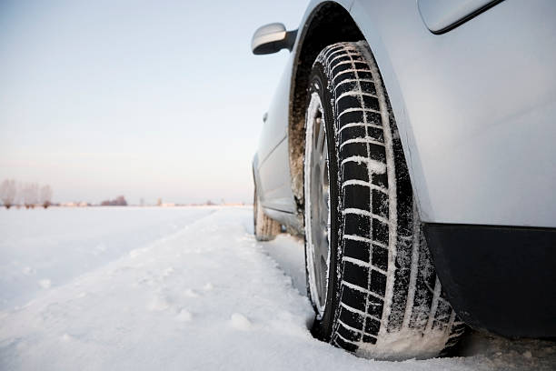 Car standing on a snowy street stock photo